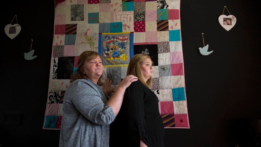 Sandra Flynn and her daughter Jasmine in front of a patchwork quilt they had made from Kayleigh Flynn’s favourite clothes. Kayleigh, Sandra’s daughter, was 16 years old when she died. Photograph: Laura Hutton/The Irish Times