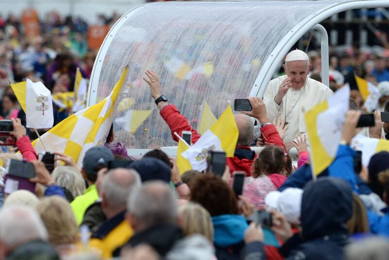 Pope Francis acknowledges devotees from the popemobile before celebrating Mass at the Papal Cross, Phoenix Park, Dublin. Photograph: Cyril Byrne/The Irish Times