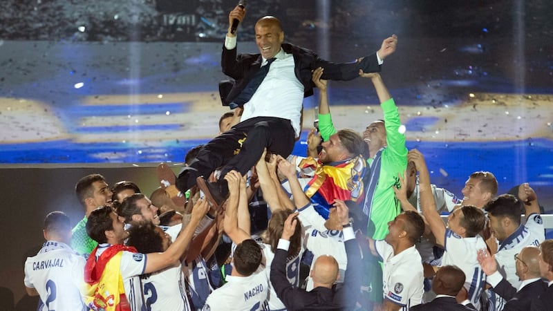 Zidane is held aloft after the 2017 Champions League triumph. Photo: Curto De La Torre/Getty Images