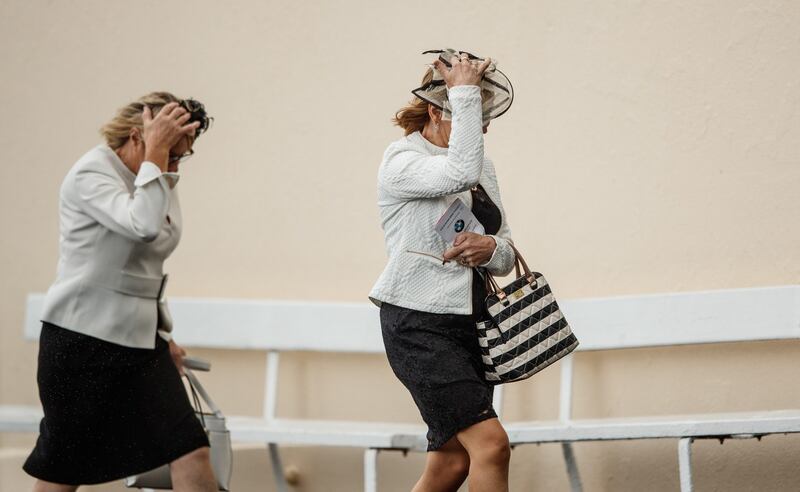 Hold on to your hats: A windy time of it on the second day of the Galway Racing Festival at Ballybrit. Photograph: James Crombie/Inpho