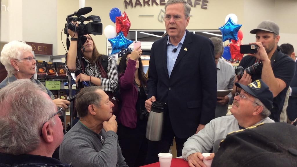 Former Florida governor Jeb Bush serving coffee to military veterans in Johnston, Iowa, to mark Veterans Day. Photograph: Simon Carswell/The Irish Times