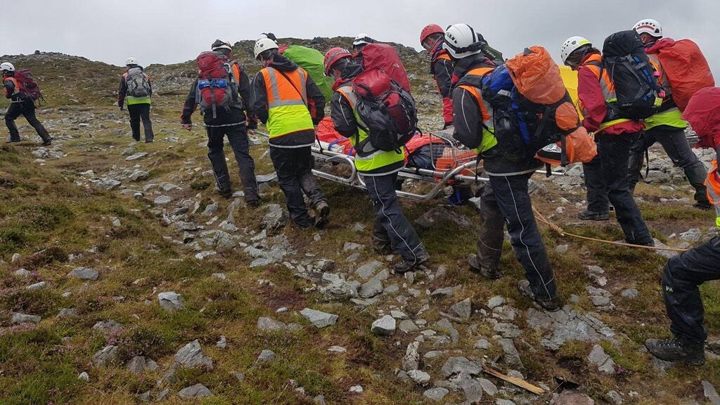Members of Mayo Mountain Rescue helping a casualty off Croagh Patrick on Sunday. Photograph: Mayo Mountain Rescue