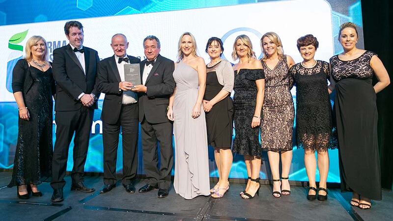 David Anchell, Managing Director, CAMIDA presents the Pharma Company of the Year - Large award to the Chanelle Pharma team.