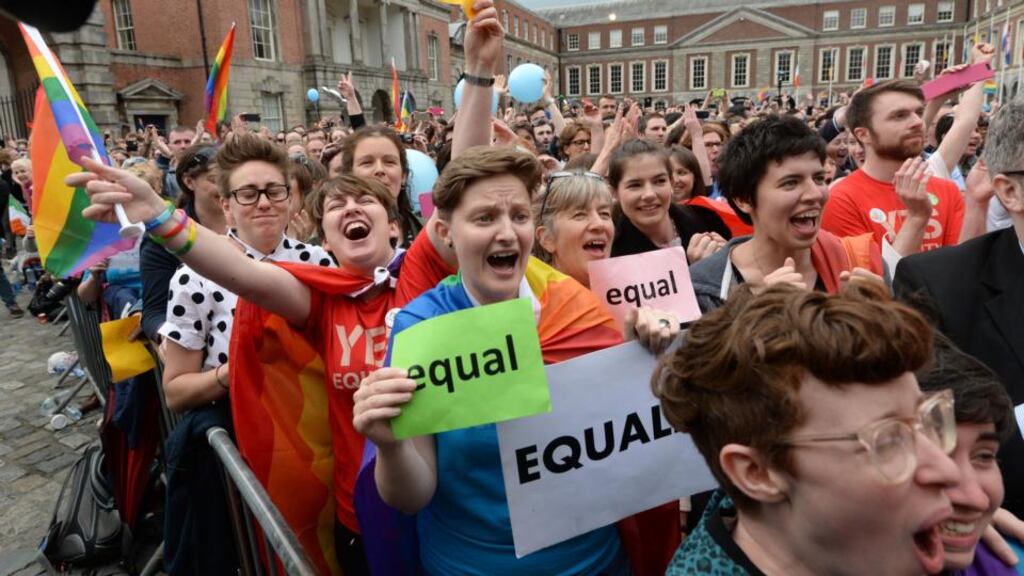Crowds react in the courtyard at Dublin Castle the Yes vote in the referendum on same-sex marrage. An ally of chancellor Angela Merkel has ruled out allowing Germany to follow the Irish example on marriage equality, saying “marriage is ... the union of man and woman”. Photograph: Dara Mac Donaill / The Irish Times