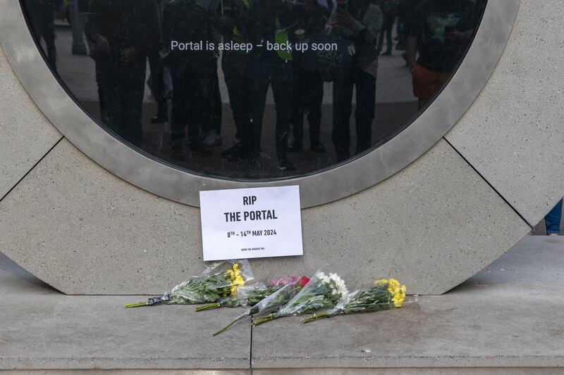 A view of flowers left at the Dublin/New York Portal on North Earl Street after is was shut down. Photograph: Tom Honan