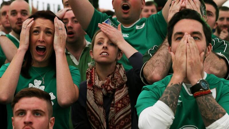 Ireland rugby supporters get a taste of looming Rugby World Cup doom in the quarter final against Argentina, at the Irish rugby village in the IFSC, Dublin. Photograph: Brian Lawless/PA Wire.