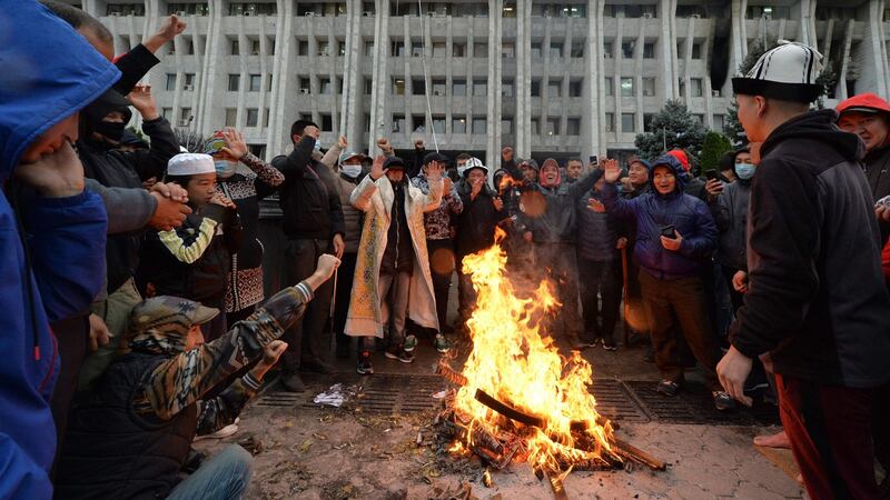 People protesting against the election results outside the government building in Bishkek. Photograph: Vyacheslav Oseledko/AFP via Getty Images