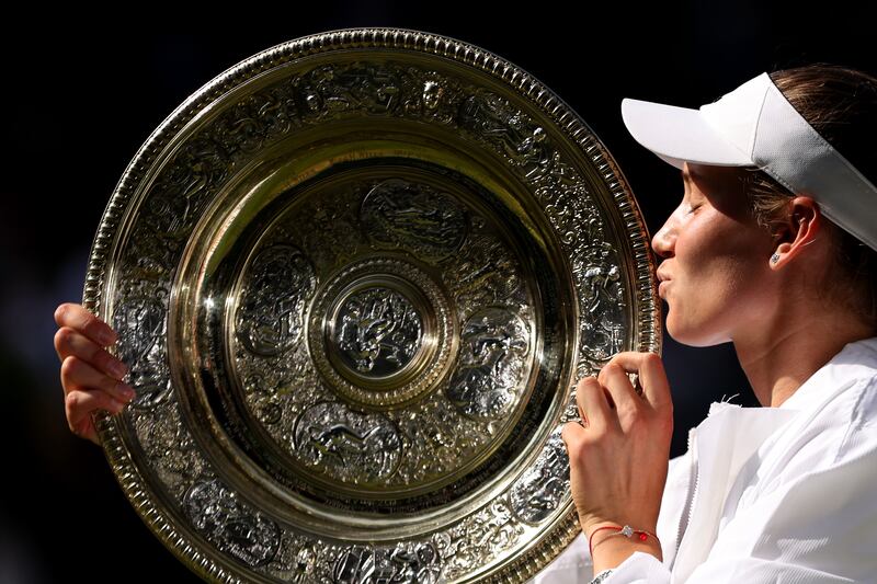New calls please: Elena Rybakina kisses the trophy after victory over Ons Jabeur of Tunisia in the Ladies' Singles final. Photograph: Clive Brunskill/Getty Images