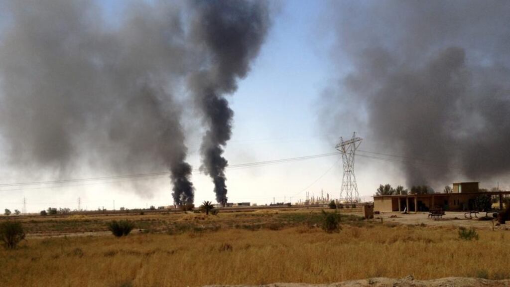 Smoke rises from the Baiji oil refinery during the clashes between the fighters of jihadist Islamic State in Iraq and the Levant (ISIL) and Iraqi forces in Baiji city, northern Iraq. Photograph: EPA