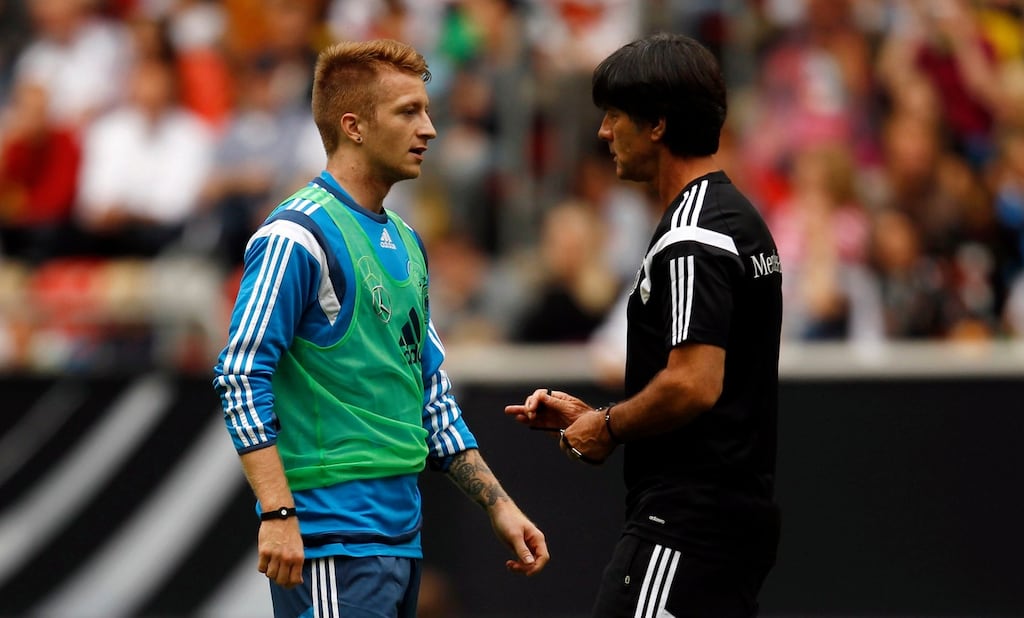 Germany coach Joachim Low talks to Marco Reus during a training session earlier this week. Photo:
Ina Fassbender/Reuters