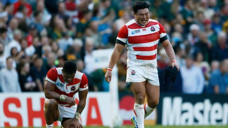 Japan’s s Hiroshi Yamashita (R) celebrates victory over South Africa. Photograph: Stefan Wermuth/Reuters