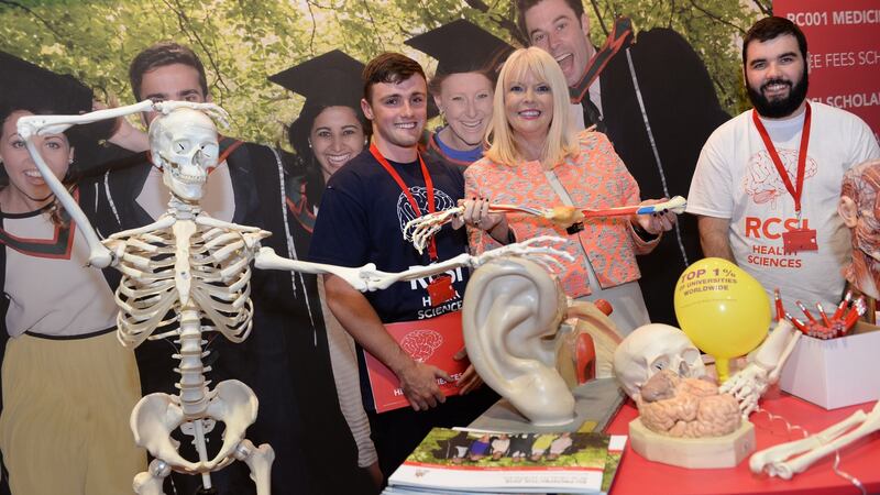 Giving a Hand: Minister of State at the Department of Education with special responsibility for Higher Education, Mary Mitchell O’Connor, TD with Gavin Dowling (left) and Conor Creagh, at the RCSI stand while visiting The Irish Times Higher Options expo in the RDS. Photograph: Dara Mac Dónaill/The Irish Times