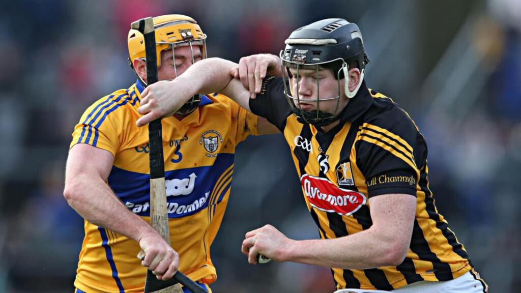 Clare’s Cian Dillon is held off by  Walter Walsh of Kilkenny at Cusack Park. PPhotograph: Cathal Noonan/Inpho