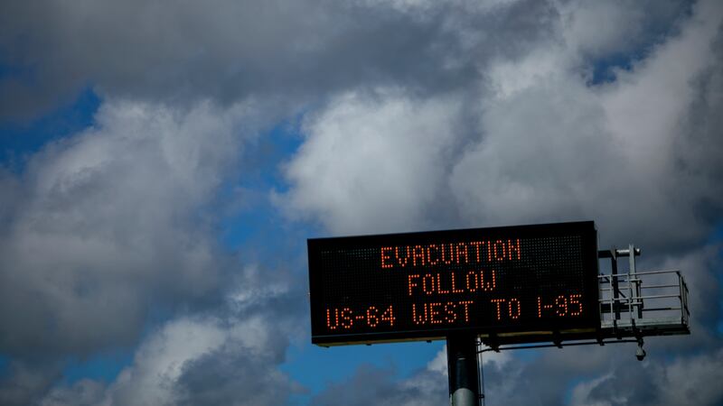 A road sign with information about evacuation routes in the Outer Banks area of North Carolina. Photograph: Eric Thayer/The New York Times