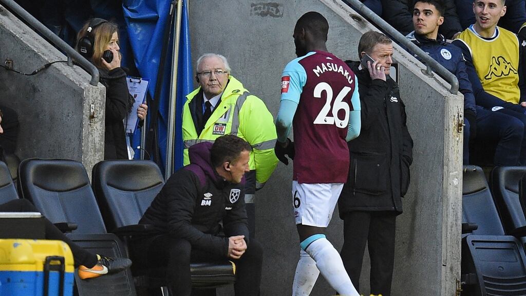 West Ham United’s Arthur Masuaku walks down the tunnel after being shown is shown a red card. Photograph: Getty Images