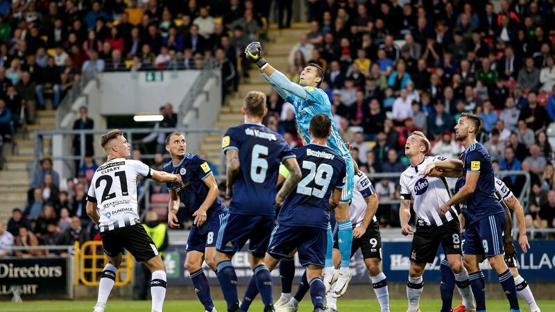 Slovan Bratislava goalkeeper Dominik Greif clears a cross. Photo: Laszlo Geczo/Inpho