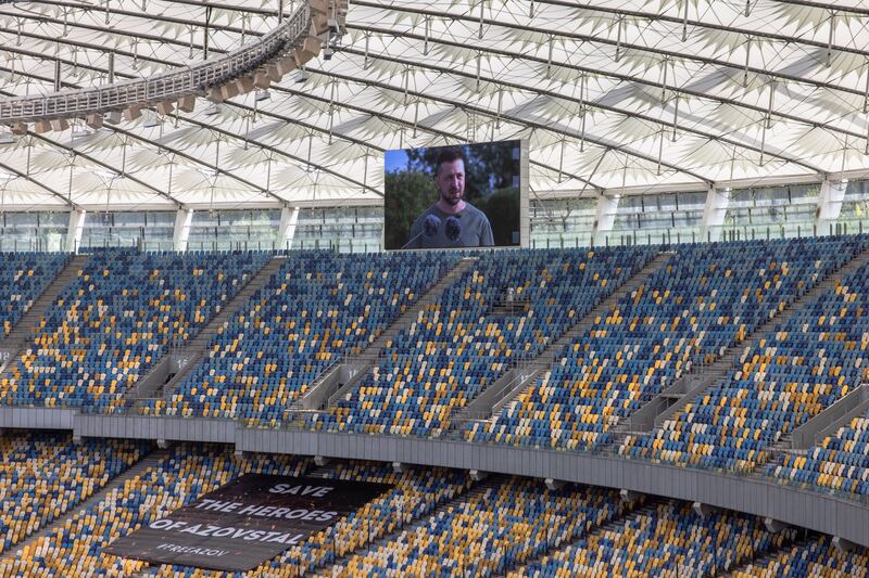 Ukrainian President Volodymyr Zelensky is seen on a screen delivering a speech. Photograph: Roman Pilipey/EPA