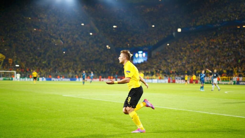 Borussia Dortmund’s Ciro Immobile celebrates after scoring against Arsenal during their Champions League Group D game. Photograph: Kai Pfaffenbach / Reuters