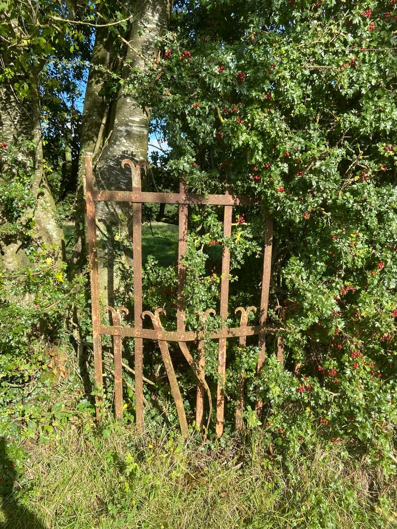 A garden gate beside the farmhouse