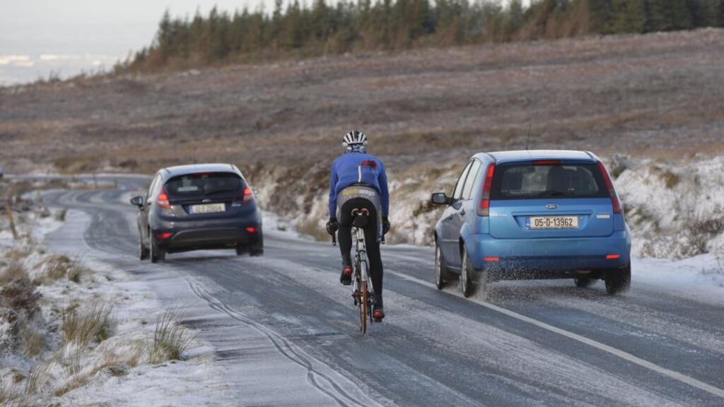 Ryan Sherlock, from Dundrum, braving recent snowfall for a cycle on Kilakee Road, near the Sally Gap. Photograph: Alan Betson