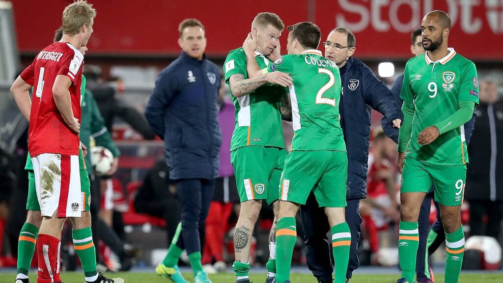 Ireland’s Seamus Colman celebrates with James McClean after beating Austria in their 2018 World Cup qualifier in Vienna. Photo: Ryan Byrne/Inpho