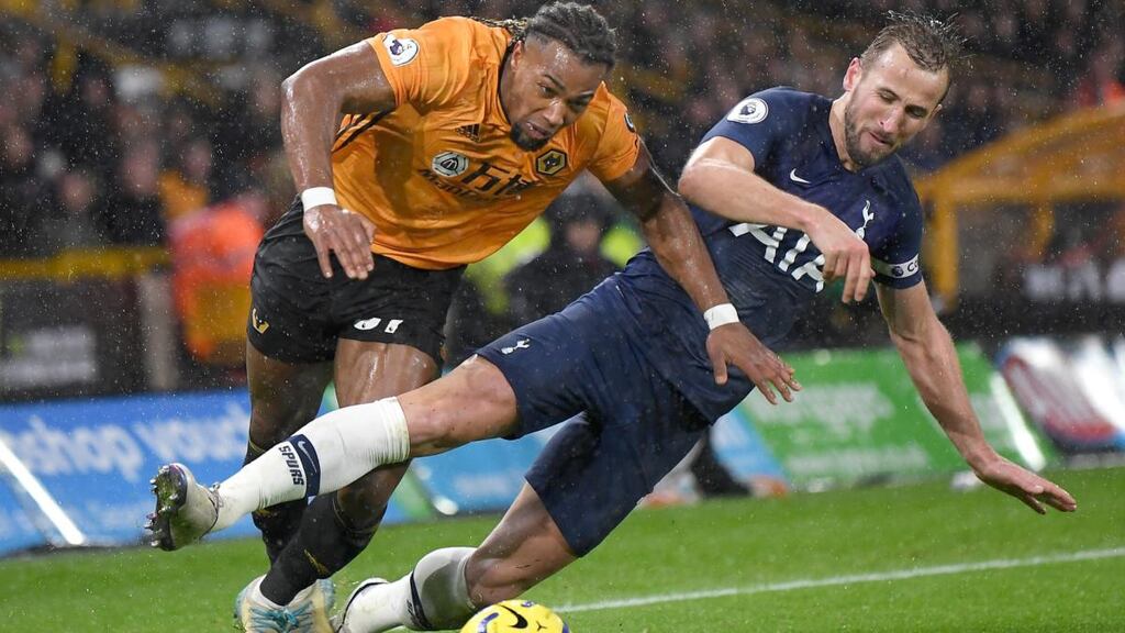 Wolverhampton Wanderers’ Adama Traoré gets taken out by Harry Kane as Tottenham set out stop the flying winger at all costs. Photograph: Michael Regan/Getty Images
