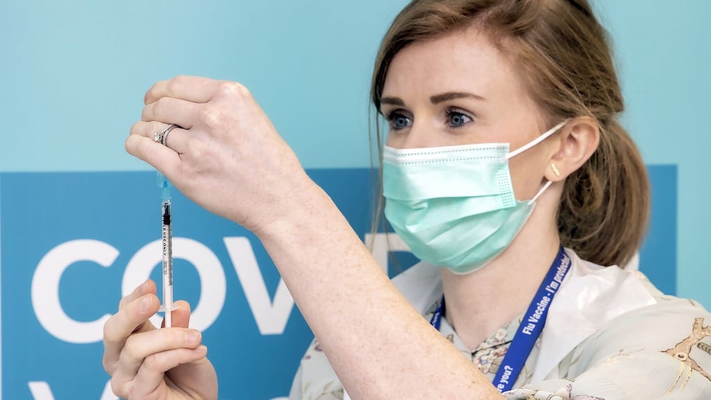 Public health nurse Karen Kennedy administering the Covid-19 vaccine.