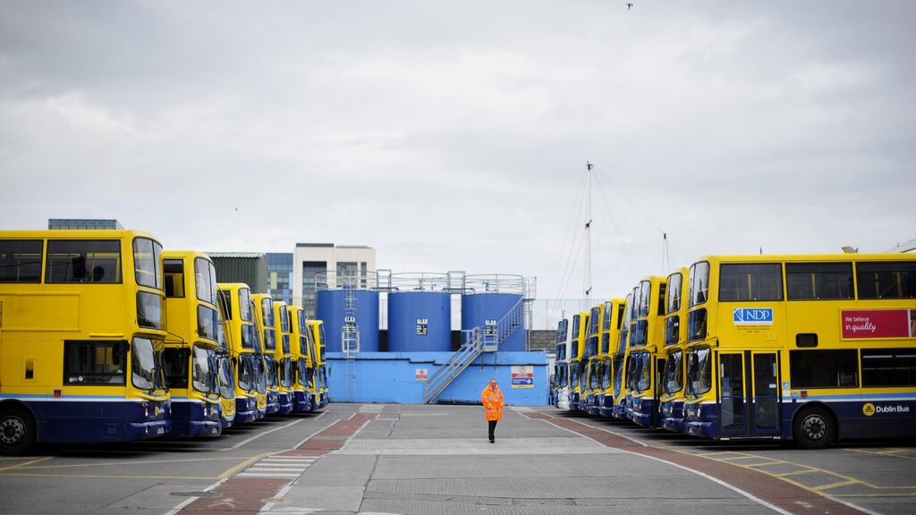 A security guard picutred by parked up buses in Dublin Bus’s Ringsend garage in Dublin last August. Pickets were placed on all Dublin bus garages after drivers voted for strike action .Photograph: Aidan Crawley/The Irish Times