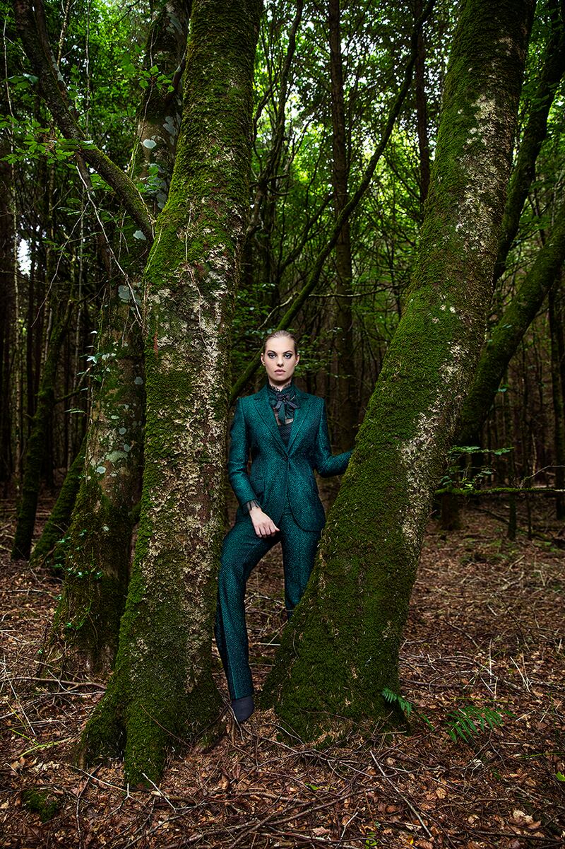 Louise Kennedy: Maya blazer in green Lurex tweed €995, Naomi trousers in green Lurex tweed €695, Bobbi blouse in green and black polka-dot tulle €495, Cassandra corsage with feathers and jet beading €195
