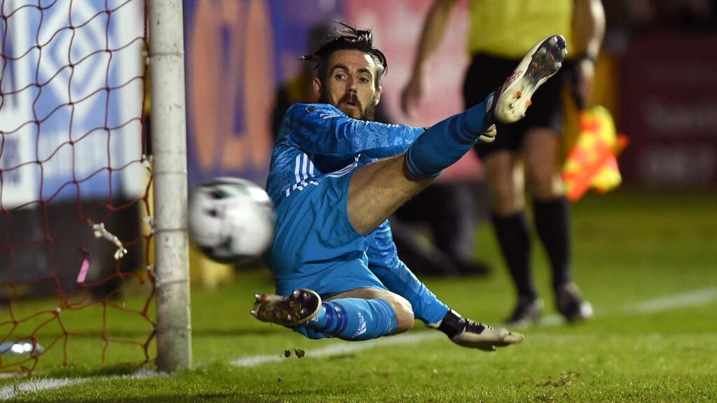 Cork City ’keeper Mark McNulty watches as Mikey Drennan’s penalty beats him at Richmond Park. Photograph: Tommy Grealy/Inpho