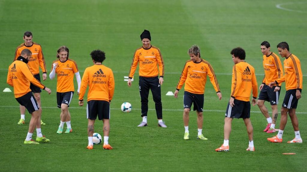 Karim Benzema (far left) passes the ball during Real Madrid’s training session at Valdebebas ahead of Sunday’s El Clasico against Barcelona at the Santiago Bernabeu . Photograph: Denis Doyle/Getty Images