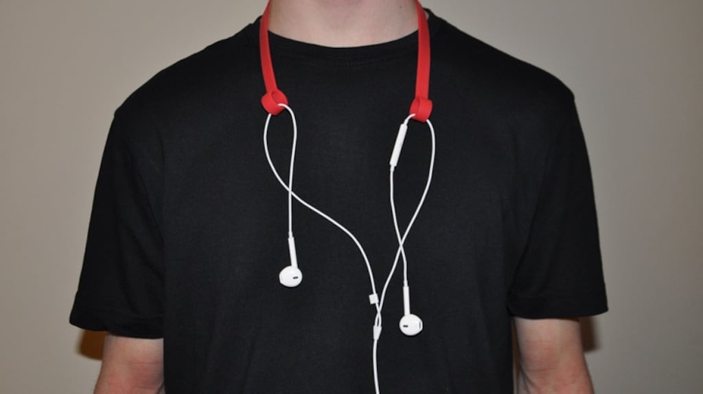 Luke Byrne’s invention comprises  a silicone band that you wear around your neck, with two loops at either end that your earbuds fit through