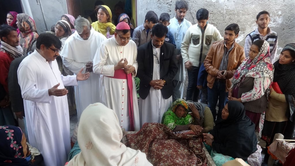 Pakistani Christians gather as they mourn the death of relatives who were killed by toxic liquor on Christmas Eve. Photograph: AFP/Getty Images