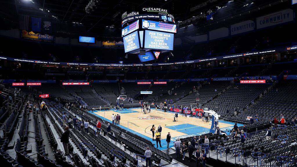 Fans leave Chesapeake Energy Arena after an announcement that the Oklahoma City Thunder vs Utah Jazz game had been canceled just before the tip off. Photograph: Alonzo Adams/Reuters.