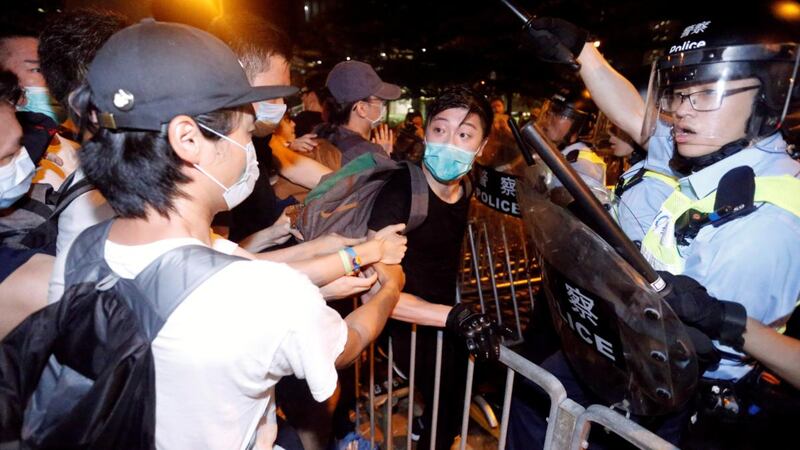 Demonstrators clash with riot police during a protest to demand authorities scrap a proposed extradition bill with China. Photograph: Thomas Peter/Reuters