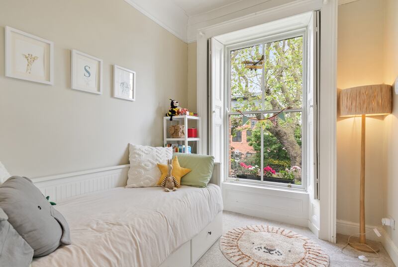 Window shutters in single bedroom