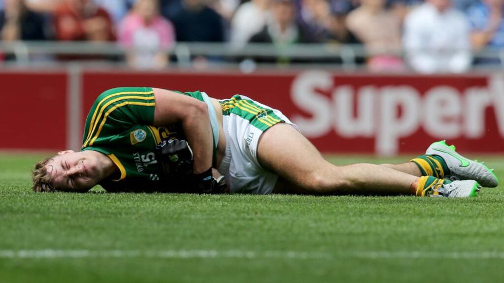 Kerry’s James O’Donoghue lies injured after he was tackled by Kildare goalkeeper Mark Donnellan during yesterday’s All-Ireland quarter-final at Croke Park. Photo: Donall Farmer
