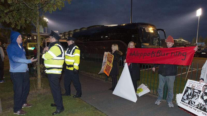 A Zenit St. Petersburg fan protests to a Garda as the Irish Syria Solidarity Movement held a demonstration outside Tallaght stadium before tonight’s Europa League match against Dundalk. Photograph: Dave Meehan/The Irish Times