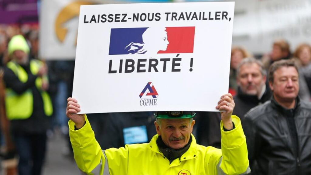 Heads of small and mid-size French companies attend a demonstration organized by the French CGPME (Confederation of Small and Medium Sized Enterprises) employers groups to protest against government policy and what they see as excessive restrictions and charges.