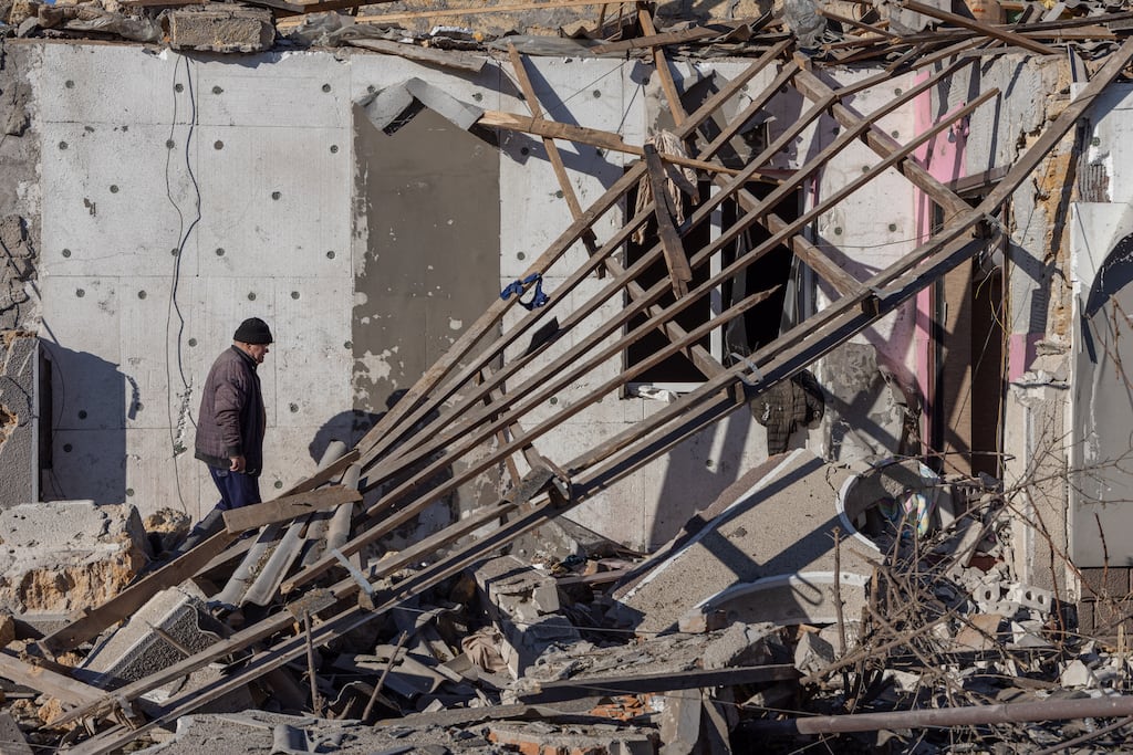 A local resident walks among debris of a destroyed building following a missile attack at an undisclosed location in Odesa region on November 17, 2024. Russia pounded Ukraine with "one of the largest" aerial attacks it has suffered in an assault that targeted the country's energy infrastructure, Kyiv's Foreign Minister Andriy Sybiga said on November 17, 2024. (Photo by Oleksandr GIMANOV / AFP) (Photo by OLEKSANDR GIMANOV/AFP via Getty Images)