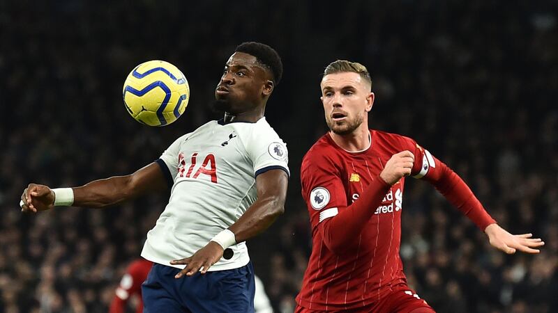 Tottenham’s Serge Aurier controls the ball under pressure from Jordan Henderson. Photo: Getty Images
