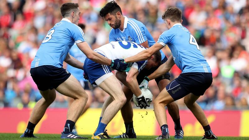 Dublin’s Brian Fenton, Mick Fitzsimons and Cian O’Sullivan snuff out an attack from Conor McManus. Photo: Ryan Byrne/Inpho