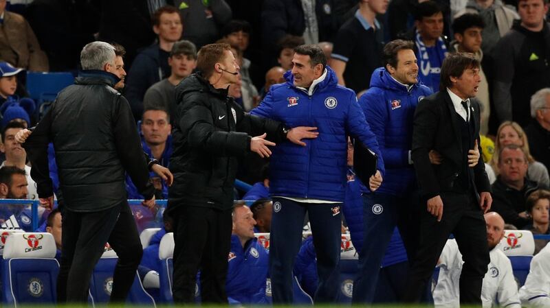 Mourinho and Conte are separated after clashing on the touchline. Photo: John Sibley/Reuters