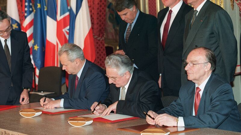 Serbian president Slobodan Milosevic, Bosnian president Alija Izetbegovic and Croatian president Franjo Tudjman signing the Dayton peace accord in 1995. Photograph: Michel Gangne/AFP/Getty Images