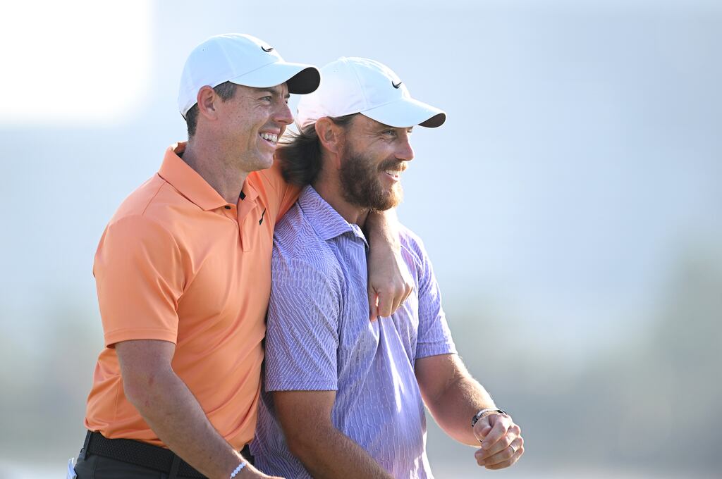 Rory McIlroy and Tommy Fleetwood embrace on the 18th green. Photograph: Alex Burstow/Getty