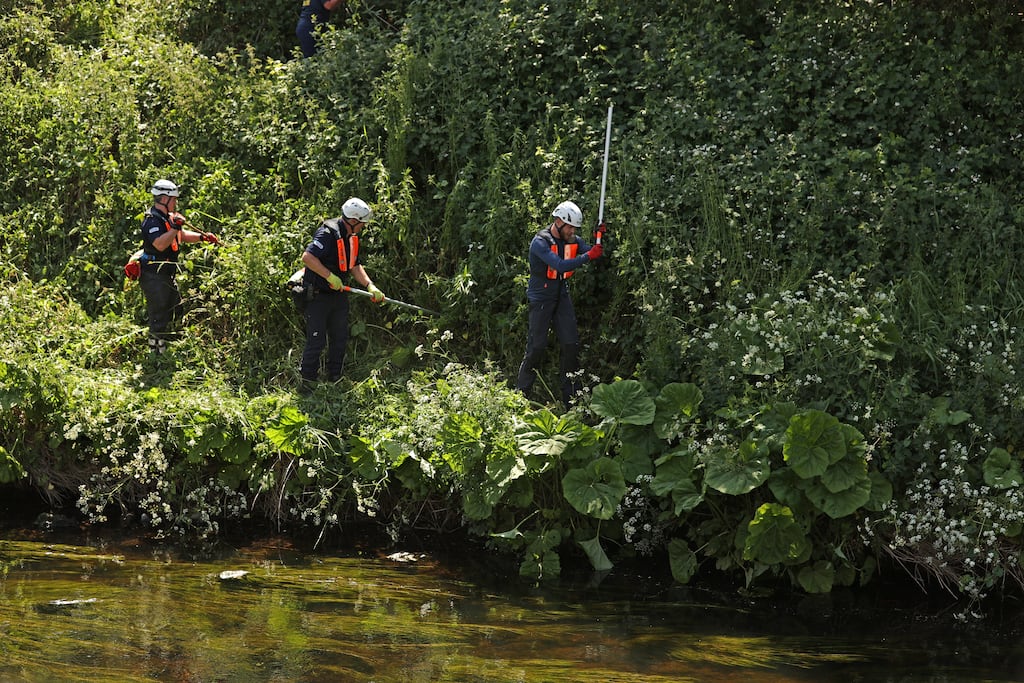 Rescue teams on the bank of the river Braid in Ballymena, where the search continues for Chloe Mitchell. Photograph: Liam McBurney/PA Wire