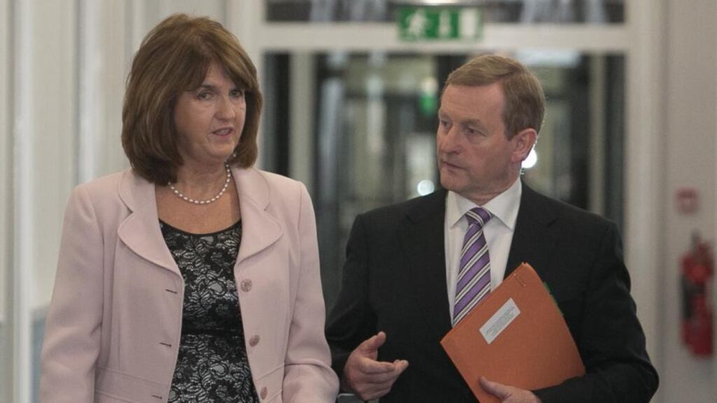 Tánaiste Joan Burton and Taoiseach Enda Kenny: the two Government parties know private polling points to voter concern that the next administration avoids policies that would undermine the turnaround. Photograph: Gareth Chaney Collins