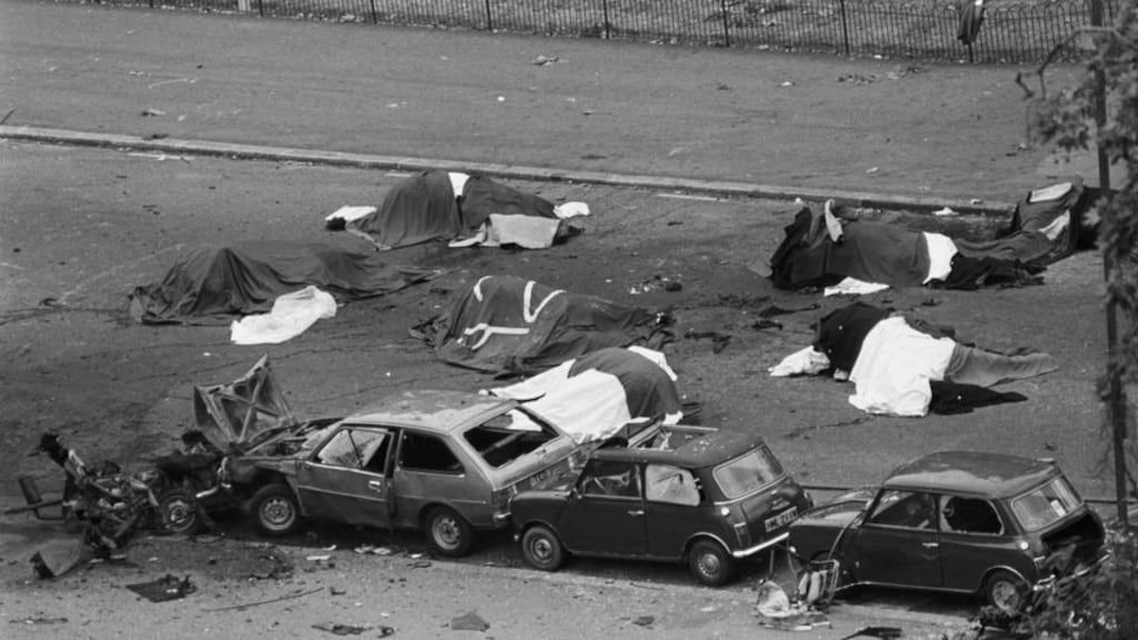 Dead horses lie covered adjacent to wrecked cars at the scene of an IRA car bombing when the Household Cavalry was passing, in Hyde Park, London, in 1982. Photograph: PA