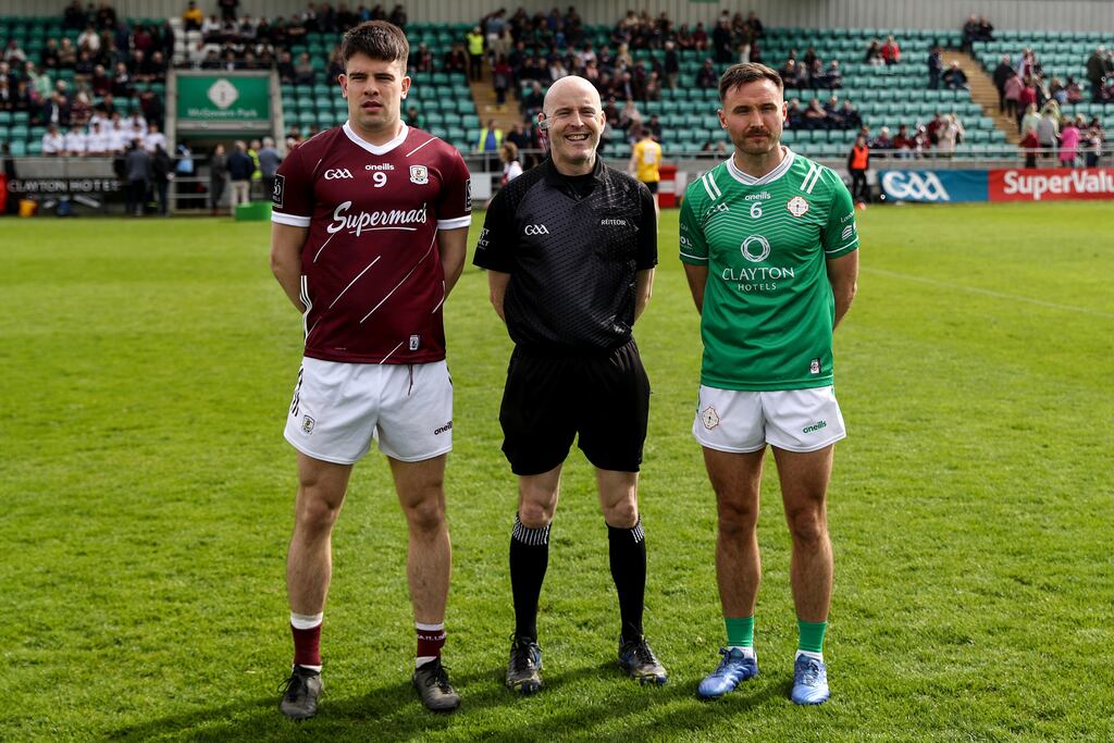 Moycullen men Seán Kelly of Galway and Eoin Walsh of London with referee Liam Devenney at McGovern Park, Ruislip. Photograph: Ben Brady/Inpho