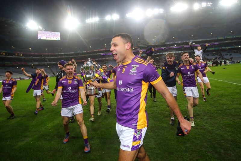 Craig Dias and his Kilmacud team-mates celebrate with the trophy at Croke Park. Photograph: Ryan Byrne/Inpho